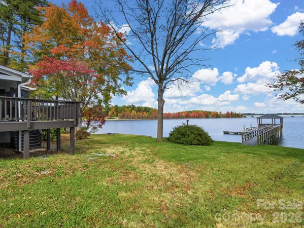a view of a house with garden yard and a patio