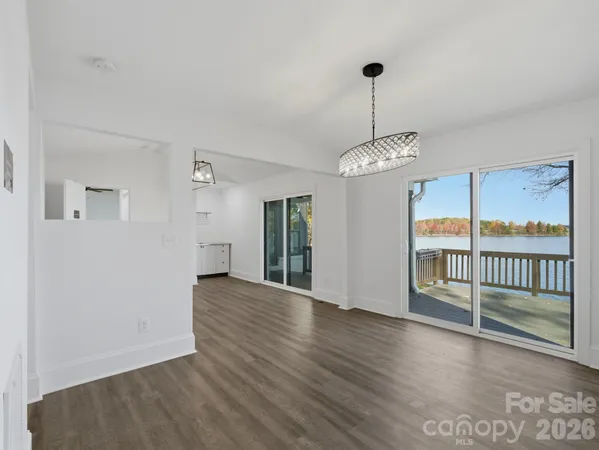 a white bath tub sitting next to a toilet