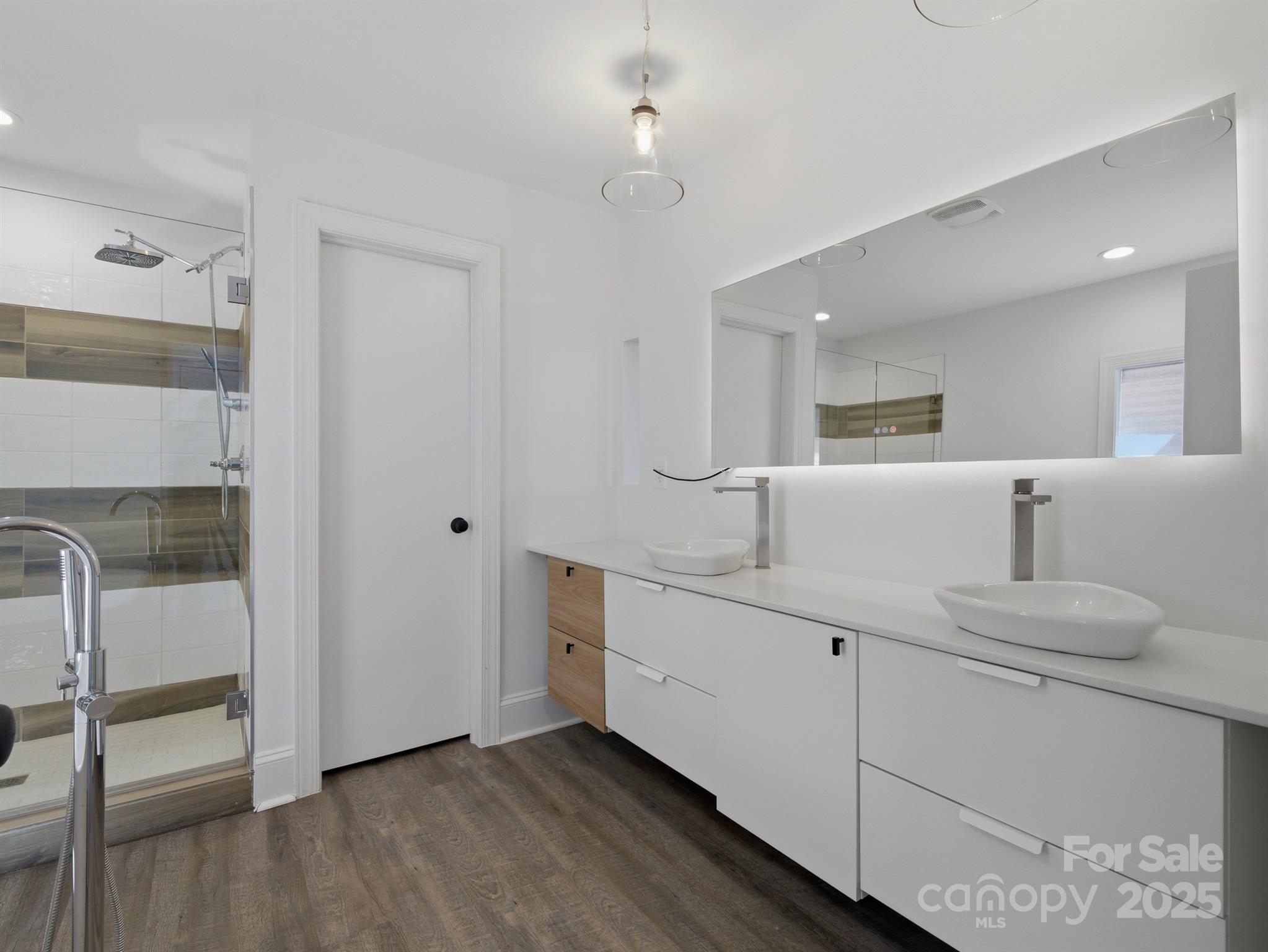 9115 Clement Circle Terrell, NC 28682 - Photo 28 of 48 a bathroom with 2 sink and a mirror