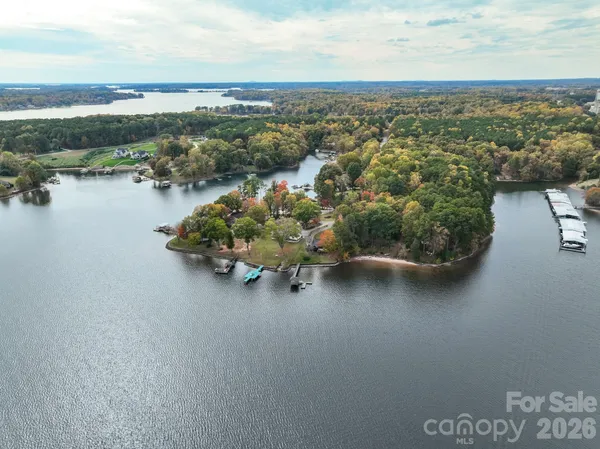 an aerial view of a house with a lake view