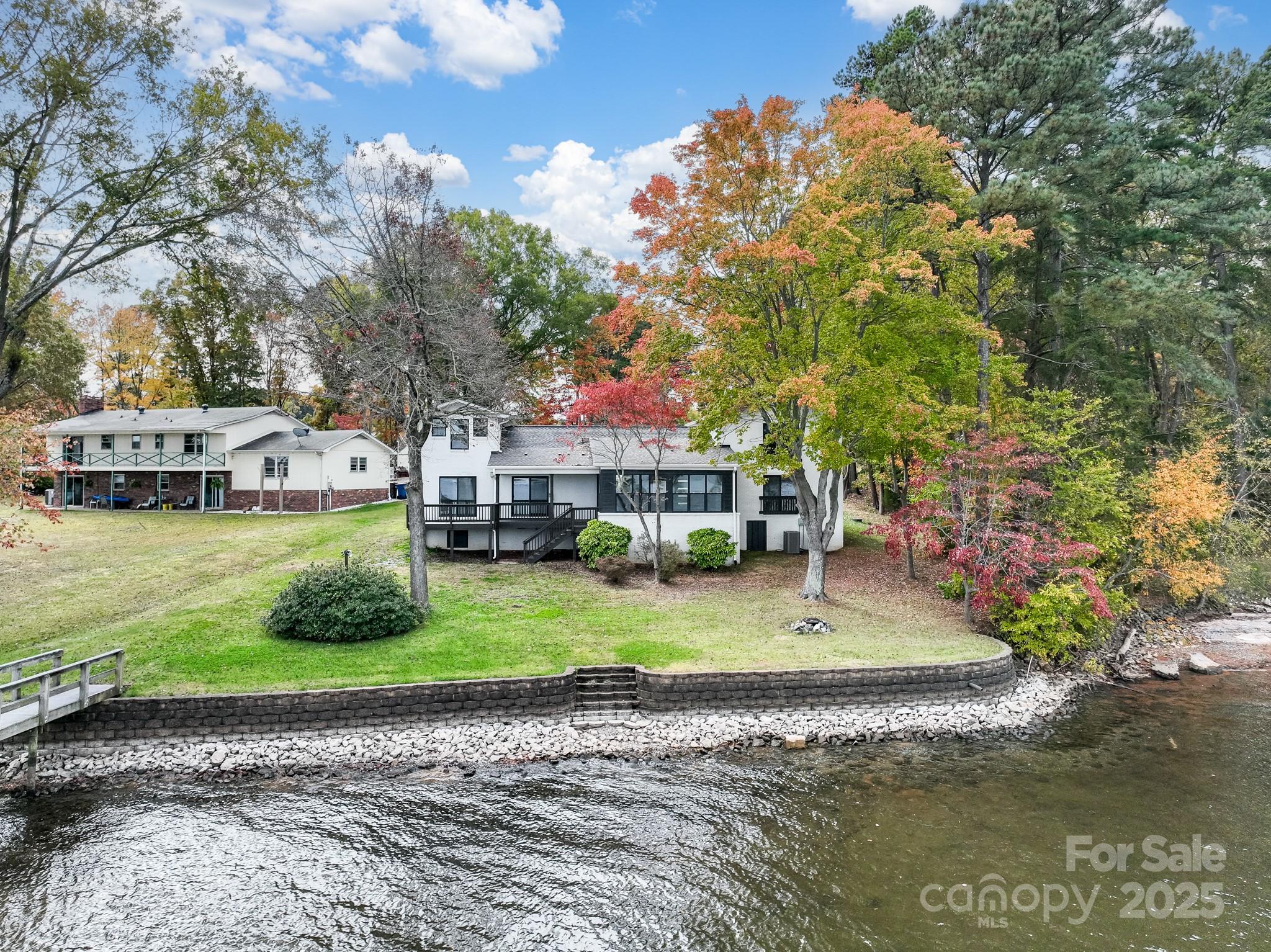 9115 Clement Circle Terrell, NC 28682 - Photo 8 of 48 a small house with a big yard and large trees