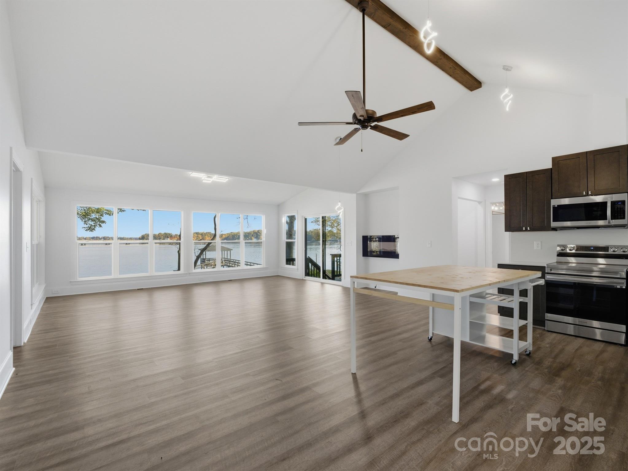9115 Clement Circle Terrell, NC 28682 - Photo 10 of 48 a view of a livingroom with furniture a ceiling fan and wooden floor