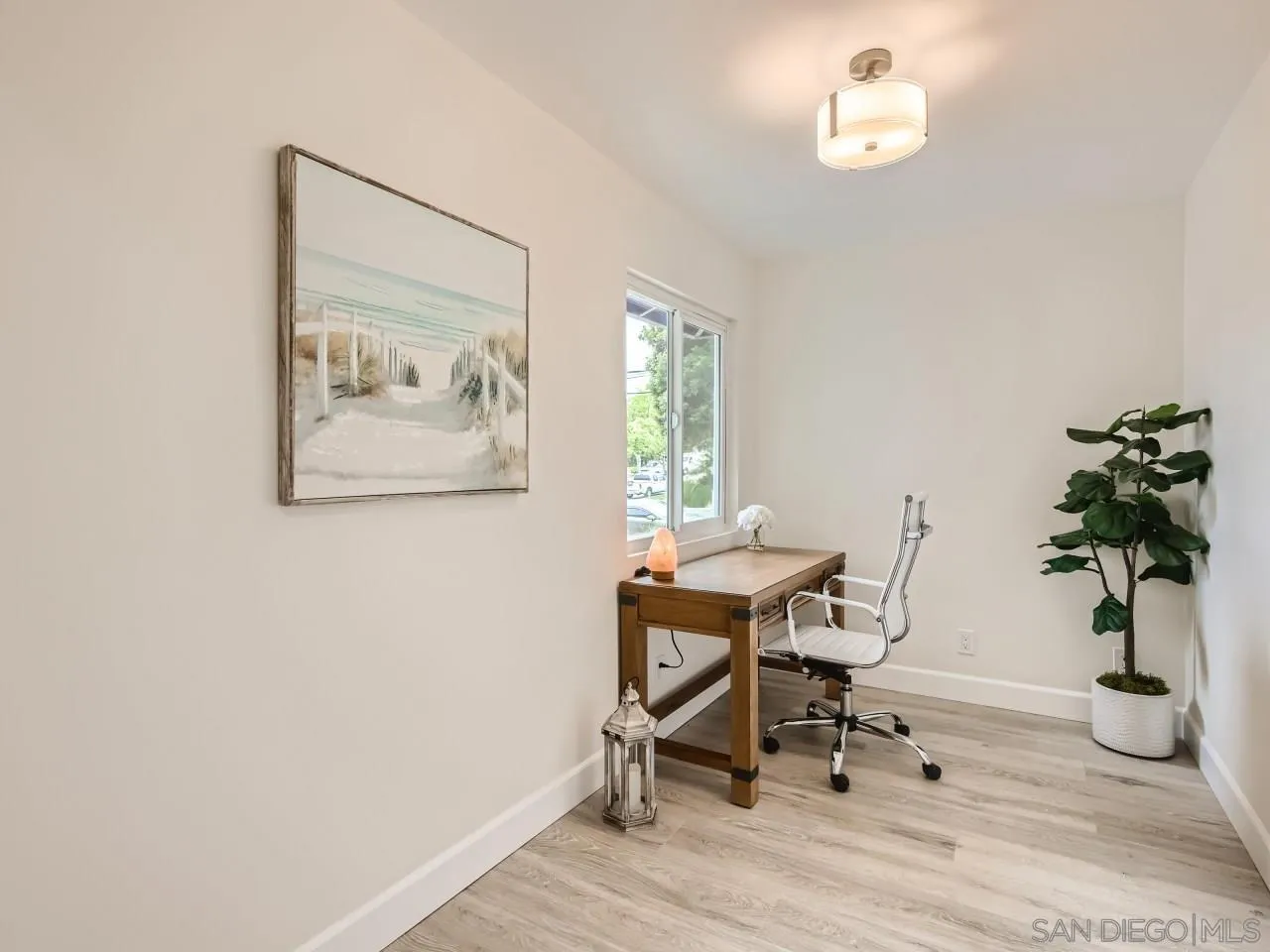 2902 Thunder Drive Oceanside, CA 92056 - Photo 14 of 30 a workspace with furniture and a potted plant