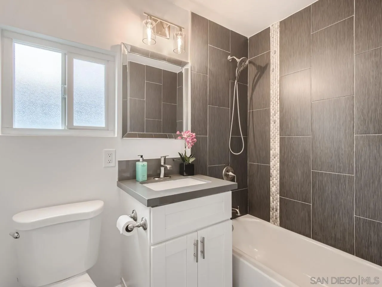 2902 Thunder Drive Oceanside, CA 92056 - Photo 20 of 30 a bathroom with a sink a toilet and shower