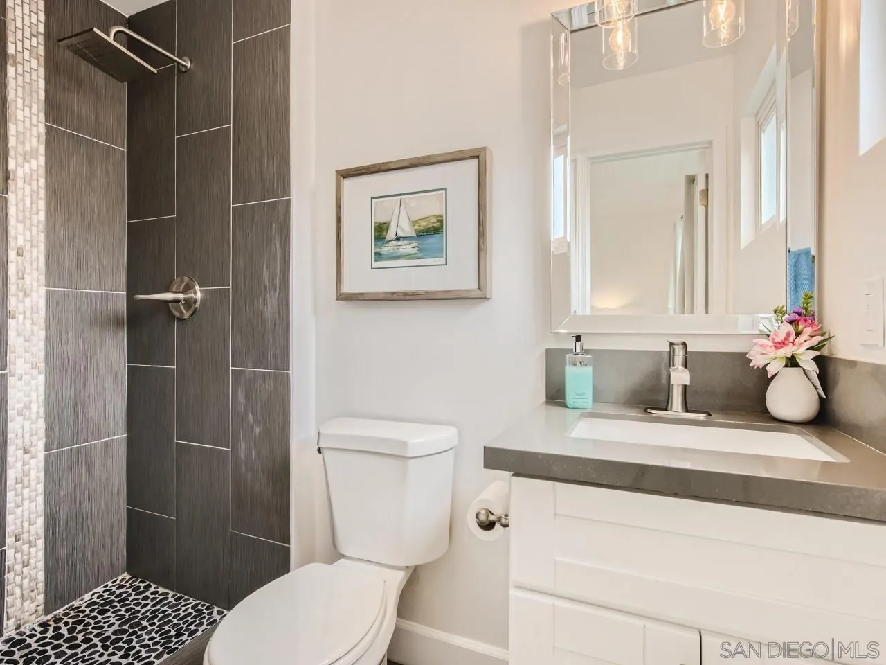 2902 Thunder Drive Oceanside, CA 92056 - Photo 21 of 30 a bathroom with a toilet sink and shower