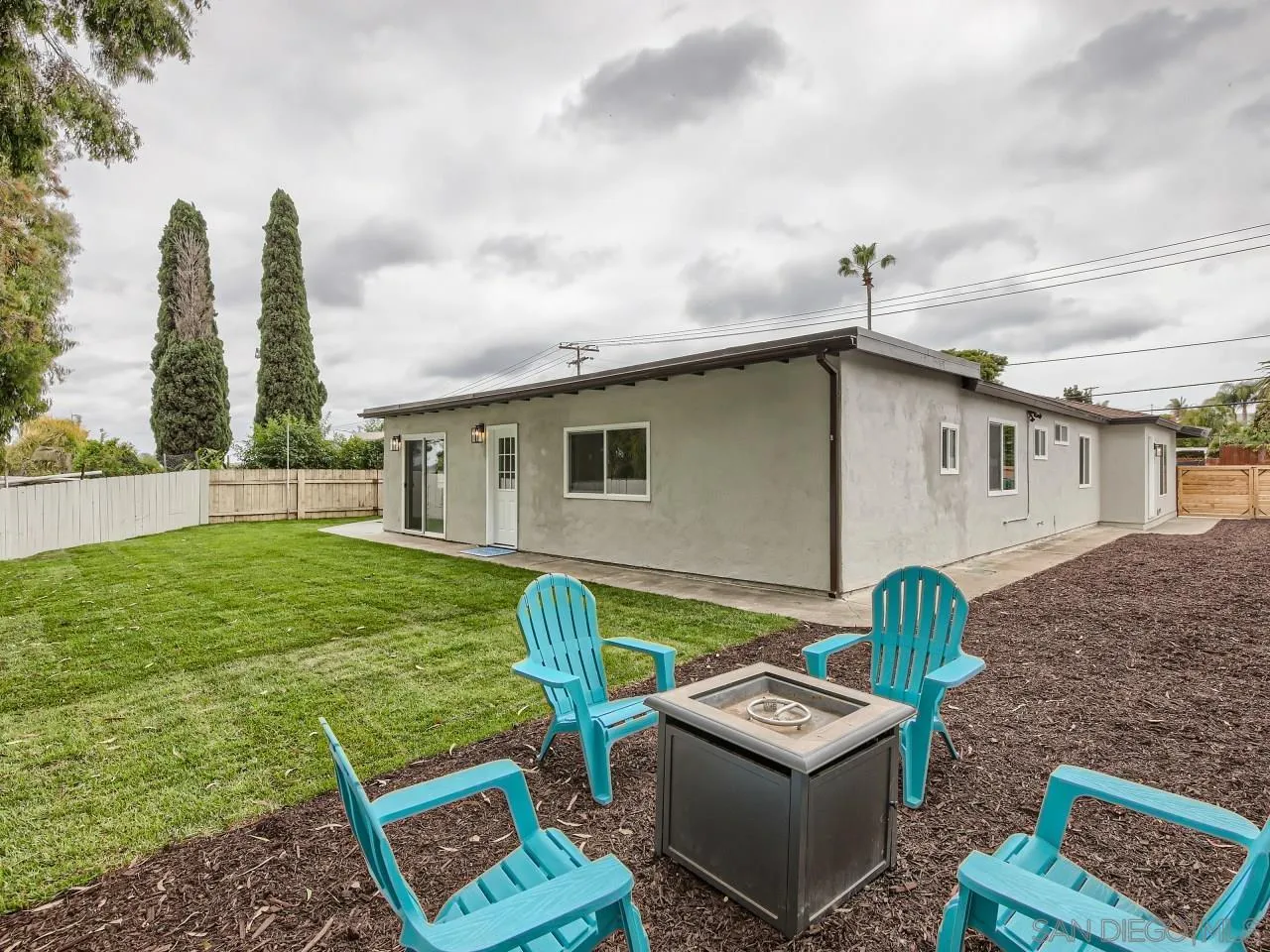 2902 Thunder Drive Oceanside, CA 92056 - Photo 27 of 30 a backyard of a house with table and chairs with plants