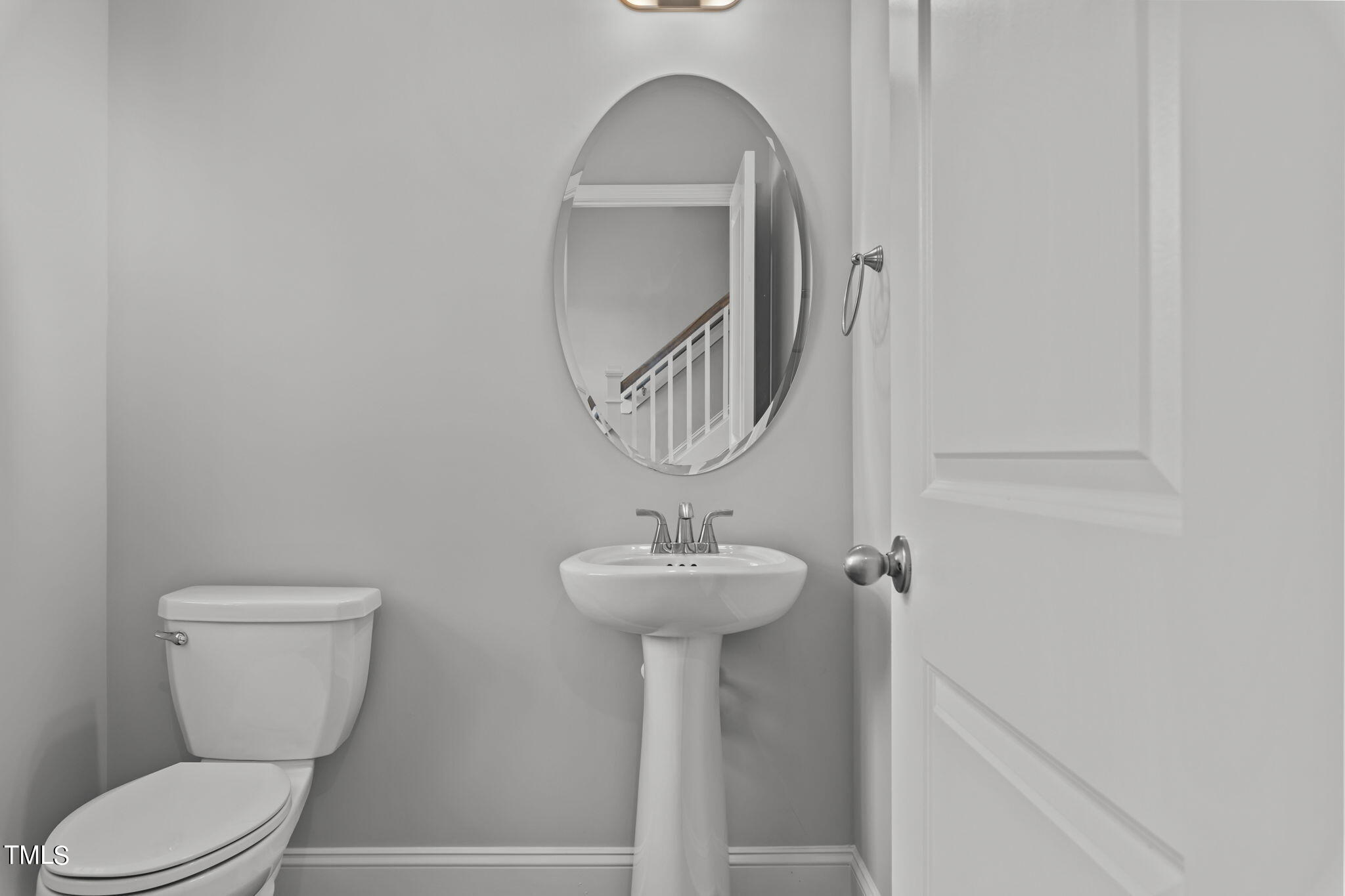 161 Regis Lane Coats, NC 27521 - Photo 14 of 38 a bathroom with a toilet sink and mirror