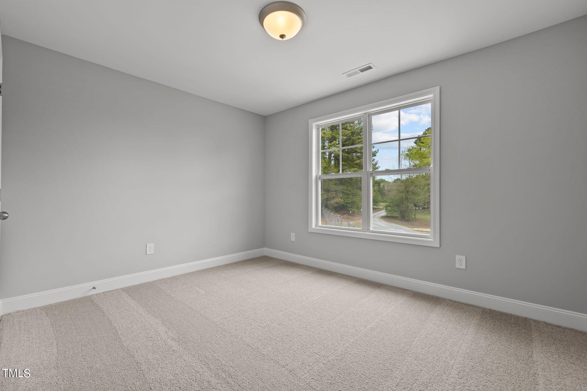 161 Regis Lane Coats, NC 27521 - Photo 19 of 38 an empty room with a window