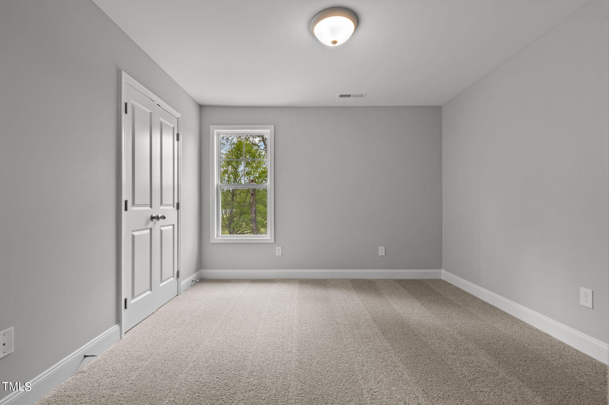 161 Regis Lane Coats, NC 27521 - Photo 21 of 38 an empty room with windows