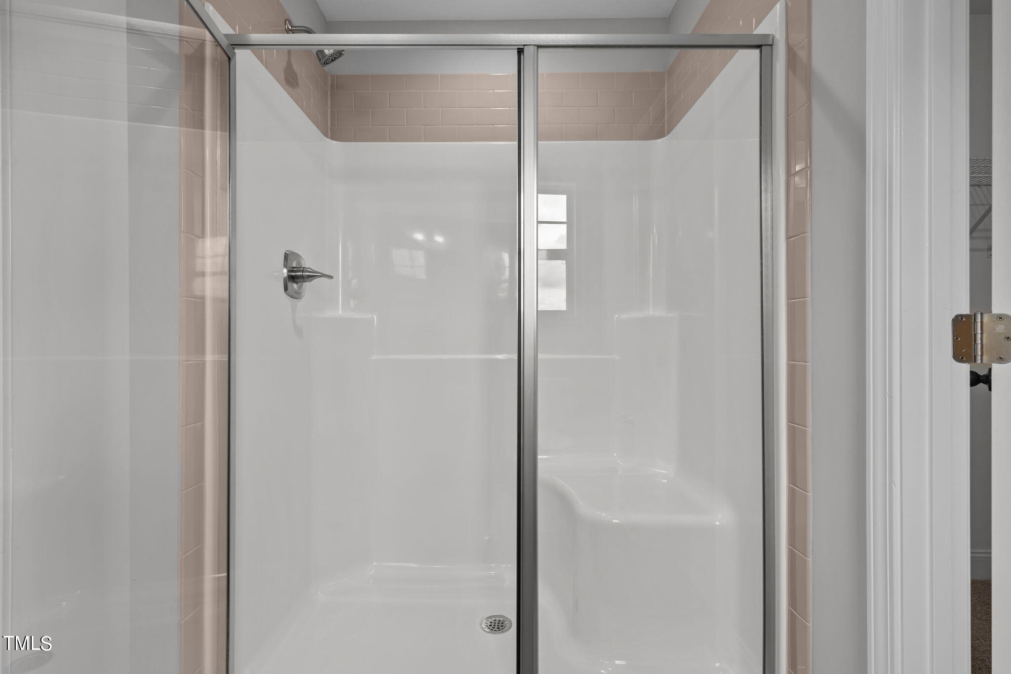 161 Regis Lane Coats, NC 27521 - Photo 27 of 38 a bathroom that has a glass shower door
