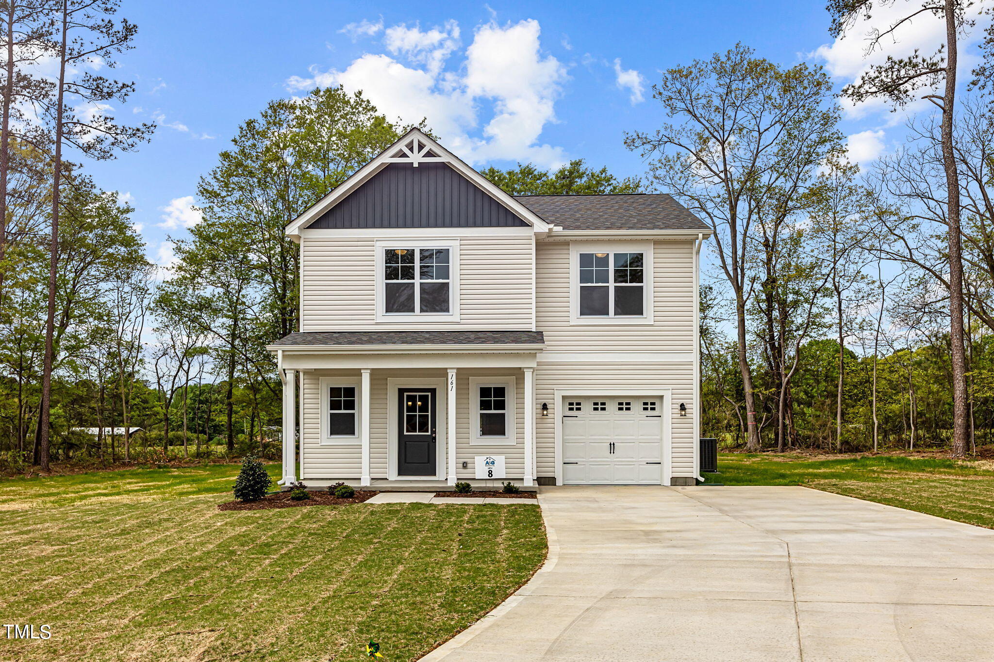 161 Regis Lane Coats, NC 27521 - Photo 3 of 38 front view of a house with a yard