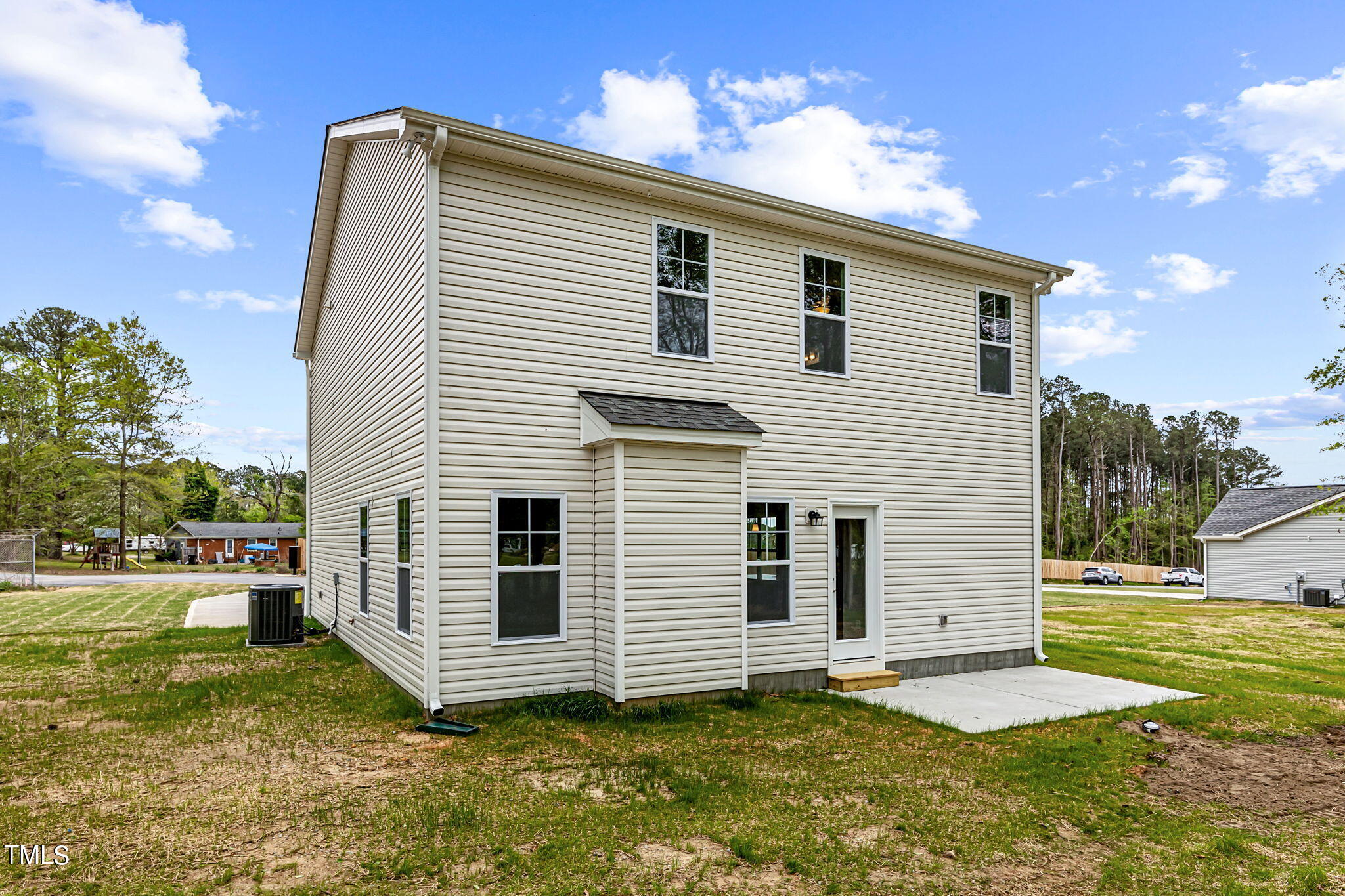161 Regis Lane Coats, NC 27521 - Photo 34 of 38 a view of a house with a yard