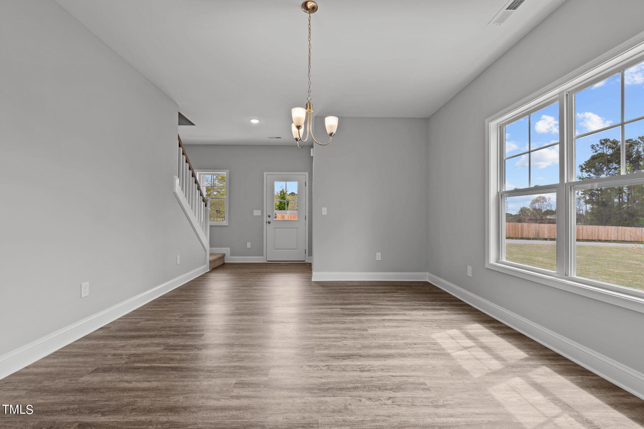 161 Regis Lane Coats, NC 27521 - Photo 7 of 38 wooden floor in an empty room with a window