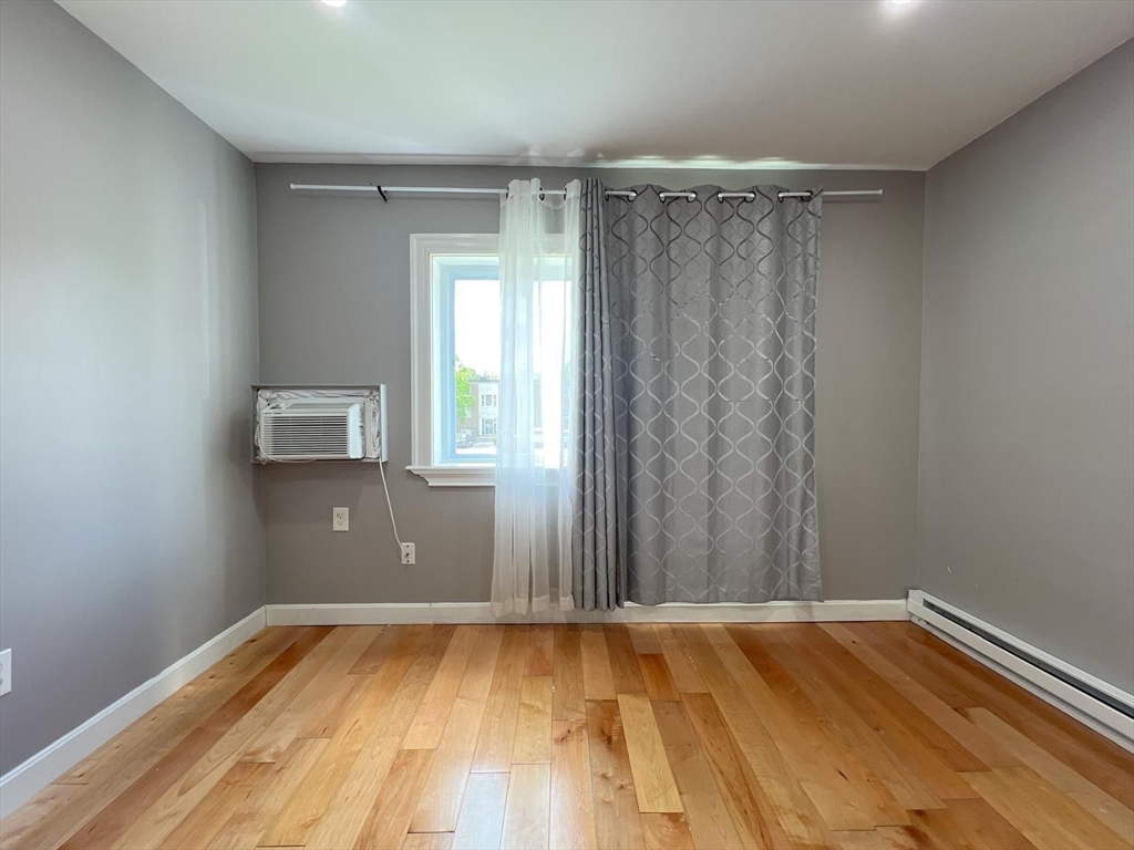 7 Weld Street, Unit 29 Framingham, MA 01702 - Photo 6 of 8 a view of a room with wooden floor and carpet