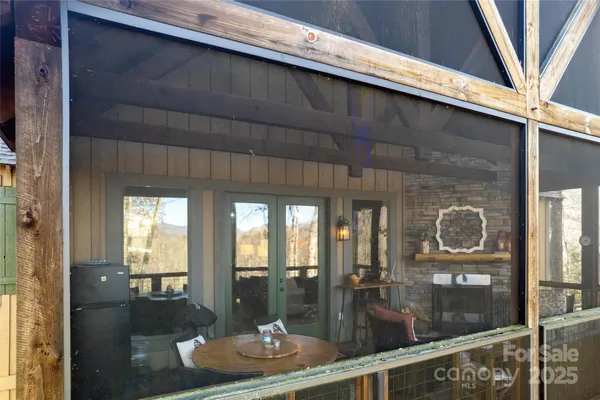 a dining room with a table and chairs