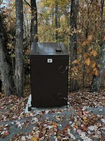 a view of a table and chairs under an umbrella