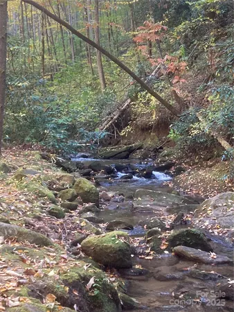 a large living room with lots of furniture and a chandelier