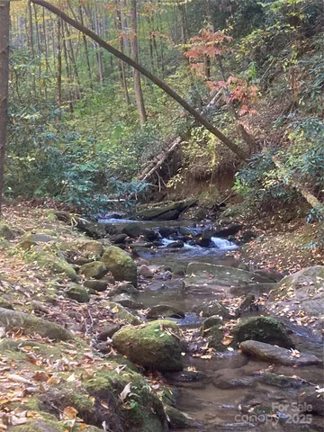 a large living room with lots of furniture and a chandelier
