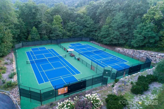 a view of swimming pool with sitting area
