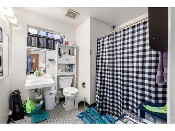a bathroom with a sink toilet and a shower