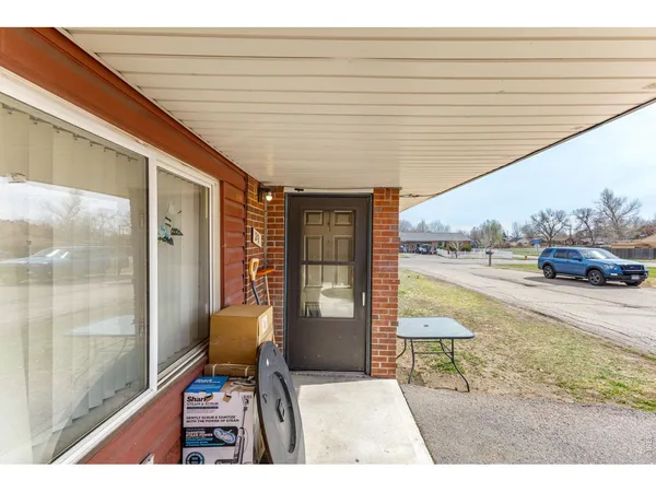 a room with furniture and a large window