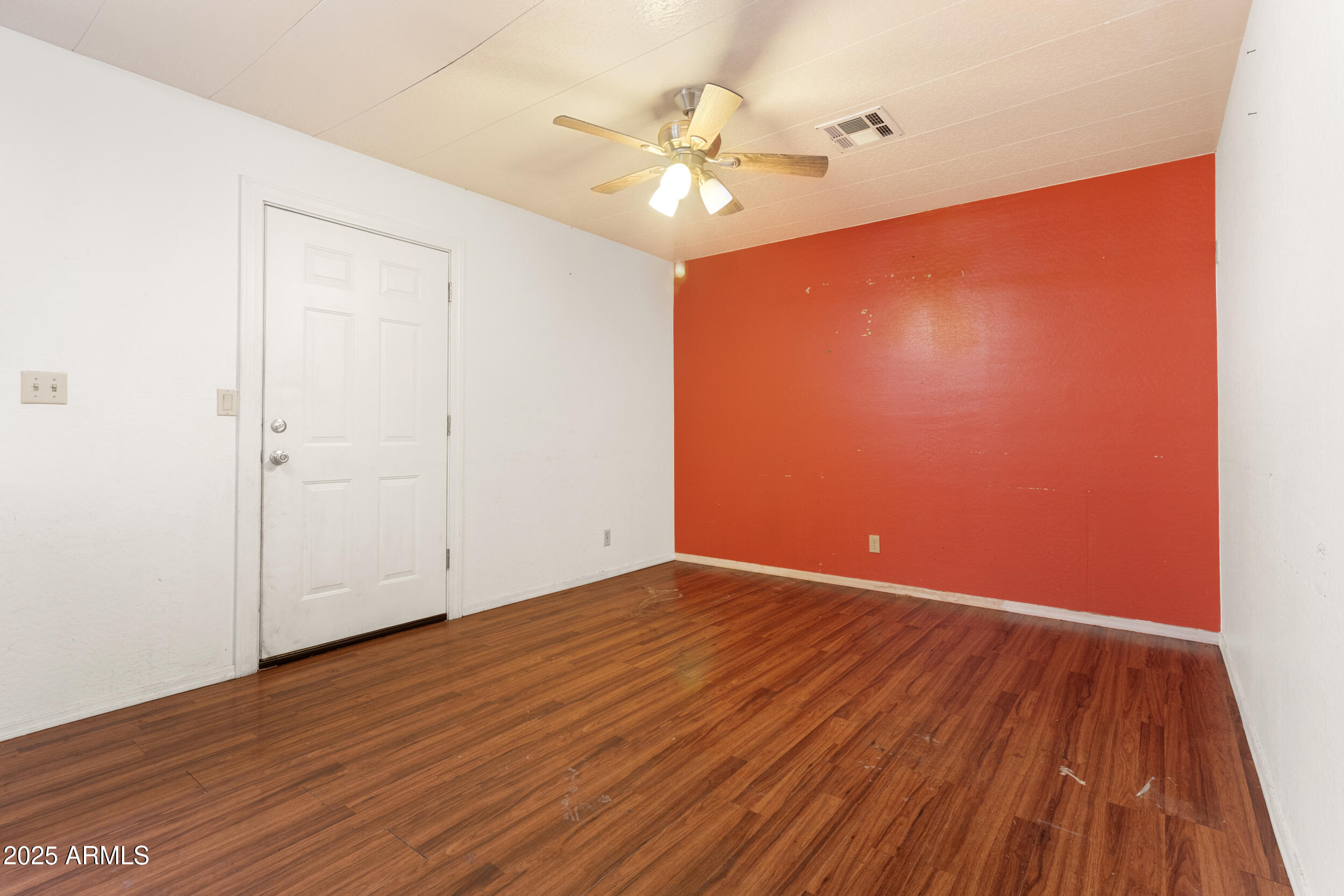 400 West Baseline Road, Unit 179 Tempe, AZ 85283 - Photo 12 of 50 a view of an empty room with wooden floor