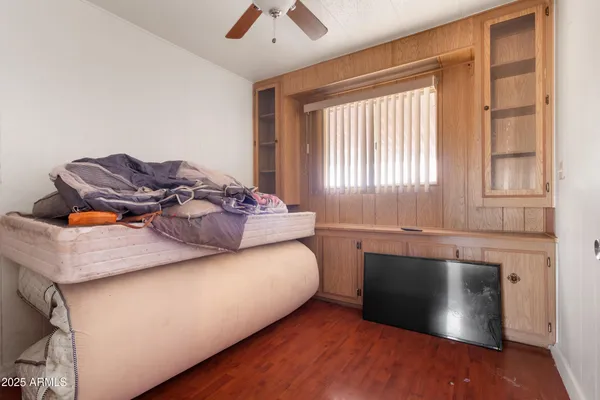 a bedroom with a bed and window