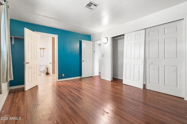 a view of a livingroom with wooden floor