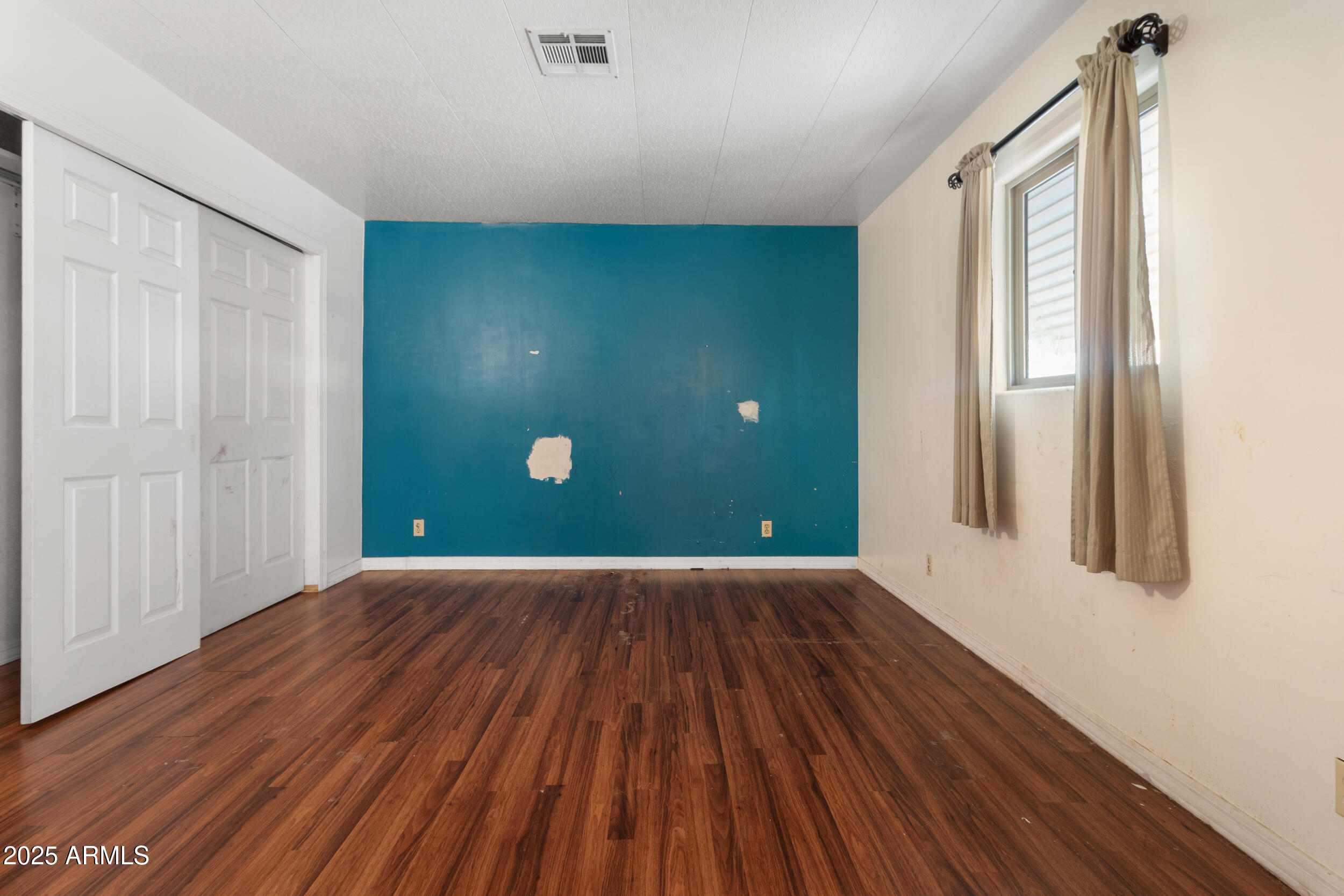 400 West Baseline Road, Unit 179 Tempe, AZ 85283 - Photo 24 of 50 a view of a room with wooden floor and windows