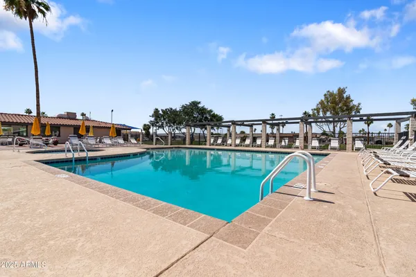a view of a swimming pool with a lake view