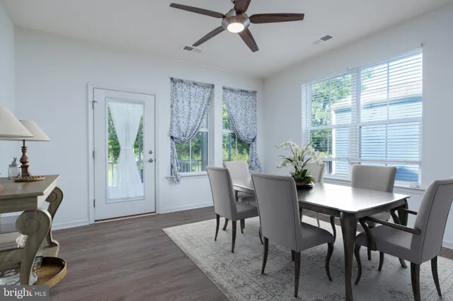 a view of a dining room with furniture window and outside view