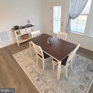 an open kitchen with a table and chairs