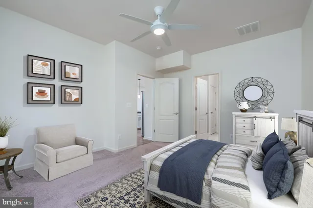 a bedroom with a bed furniture and wall painting