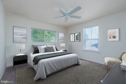 a bedroom with a bed and a large mirror