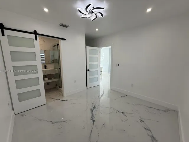 a view of a room that has a large window