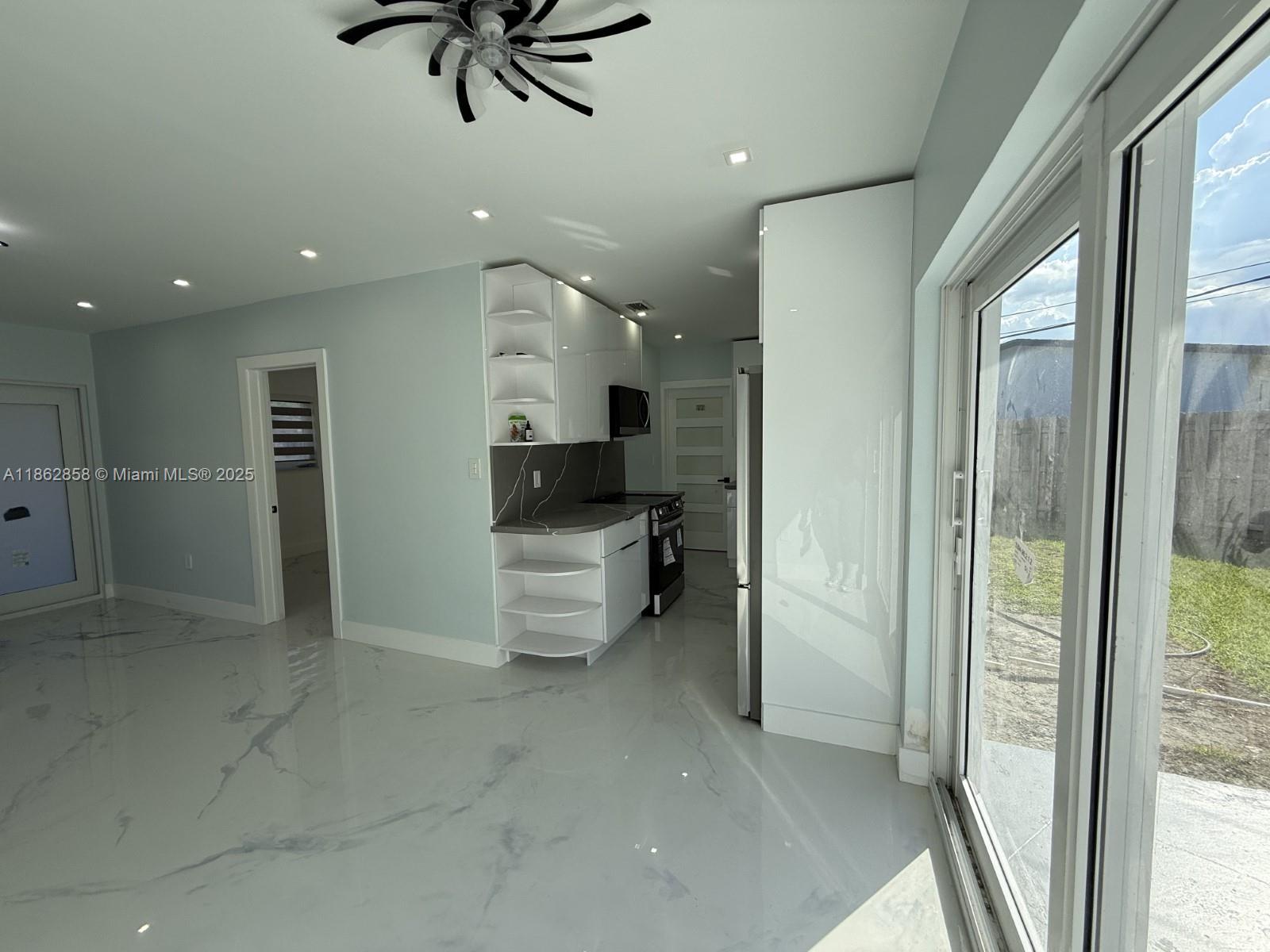 11805 Southwest 185th Street Miami, FL 33177 - Photo 19 of 28 a bathroom with a bathtub and a shower
