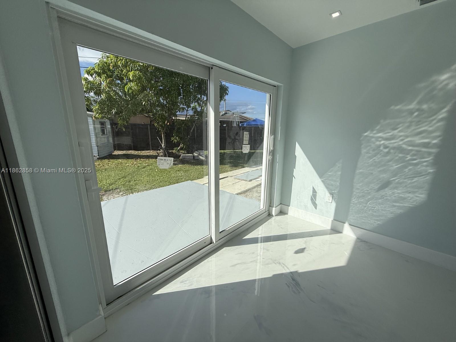 11805 Southwest 185th Street Miami, FL 33177 - Photo 20 of 28 a view of a room that has a large window
