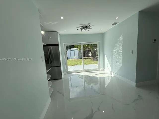 a bathroom with a bathtub and shower