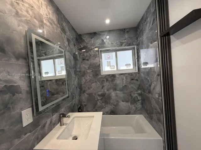 en empty room with closet and window