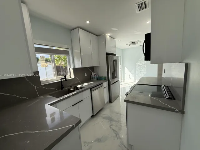 a view of empty room with windows