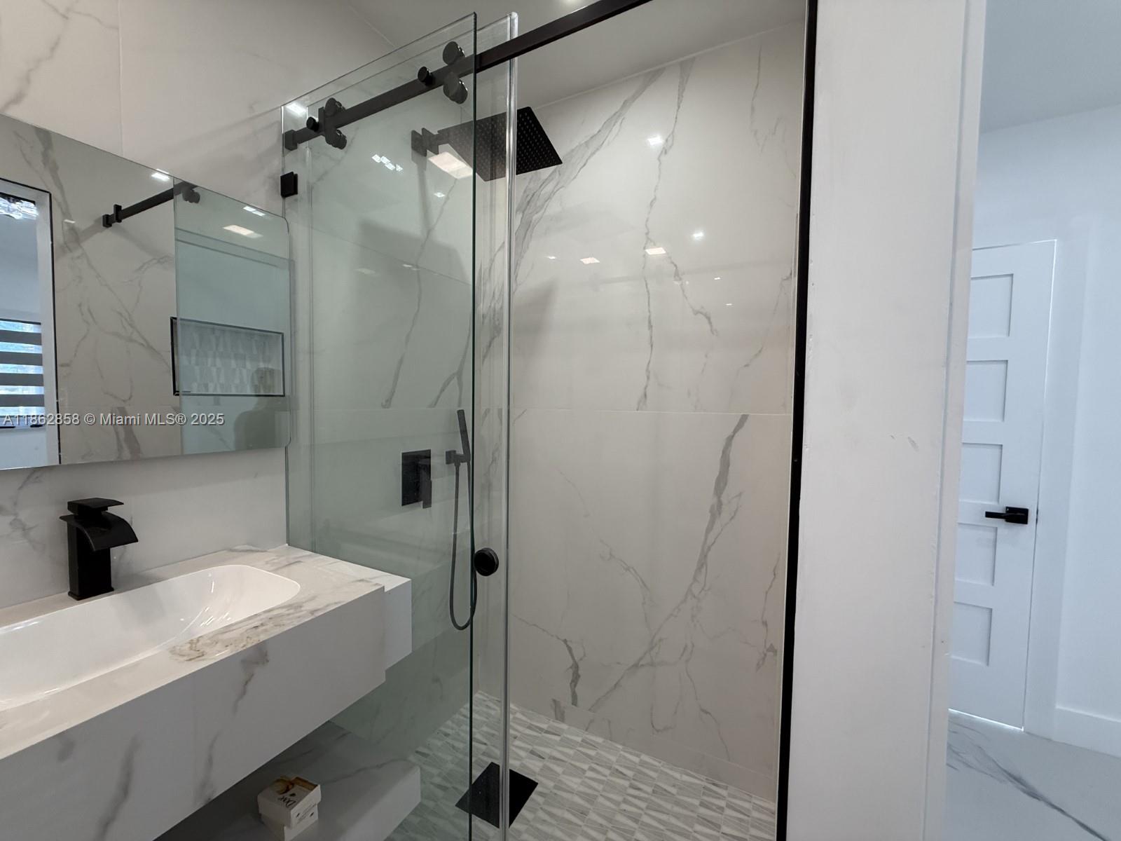 11805 Southwest 185th Street Miami, FL 33177 - Photo 27 of 28 a bathroom with a bathtub and a shower