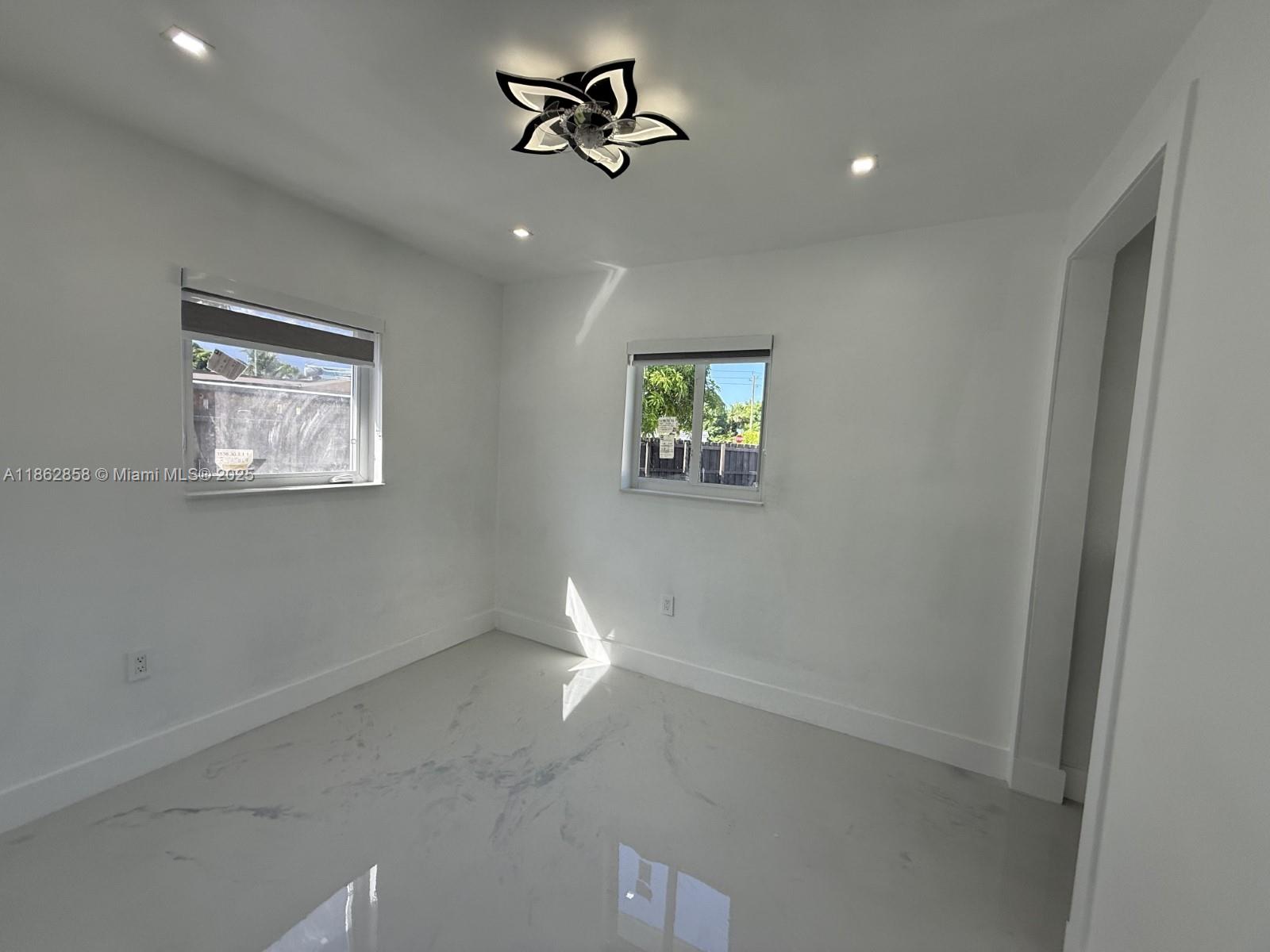 11805 Southwest 185th Street Miami, FL 33177 - Photo 28 of 28 a view of empty room with windows