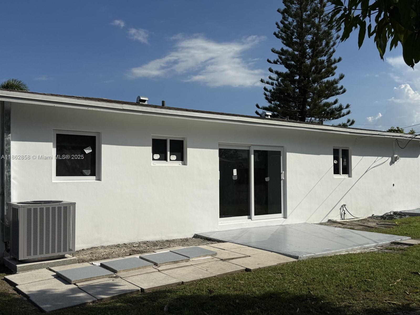 11805 Southwest 185th Street Miami, FL 33177 - Photo 3 of 28 a front view of a house with garden