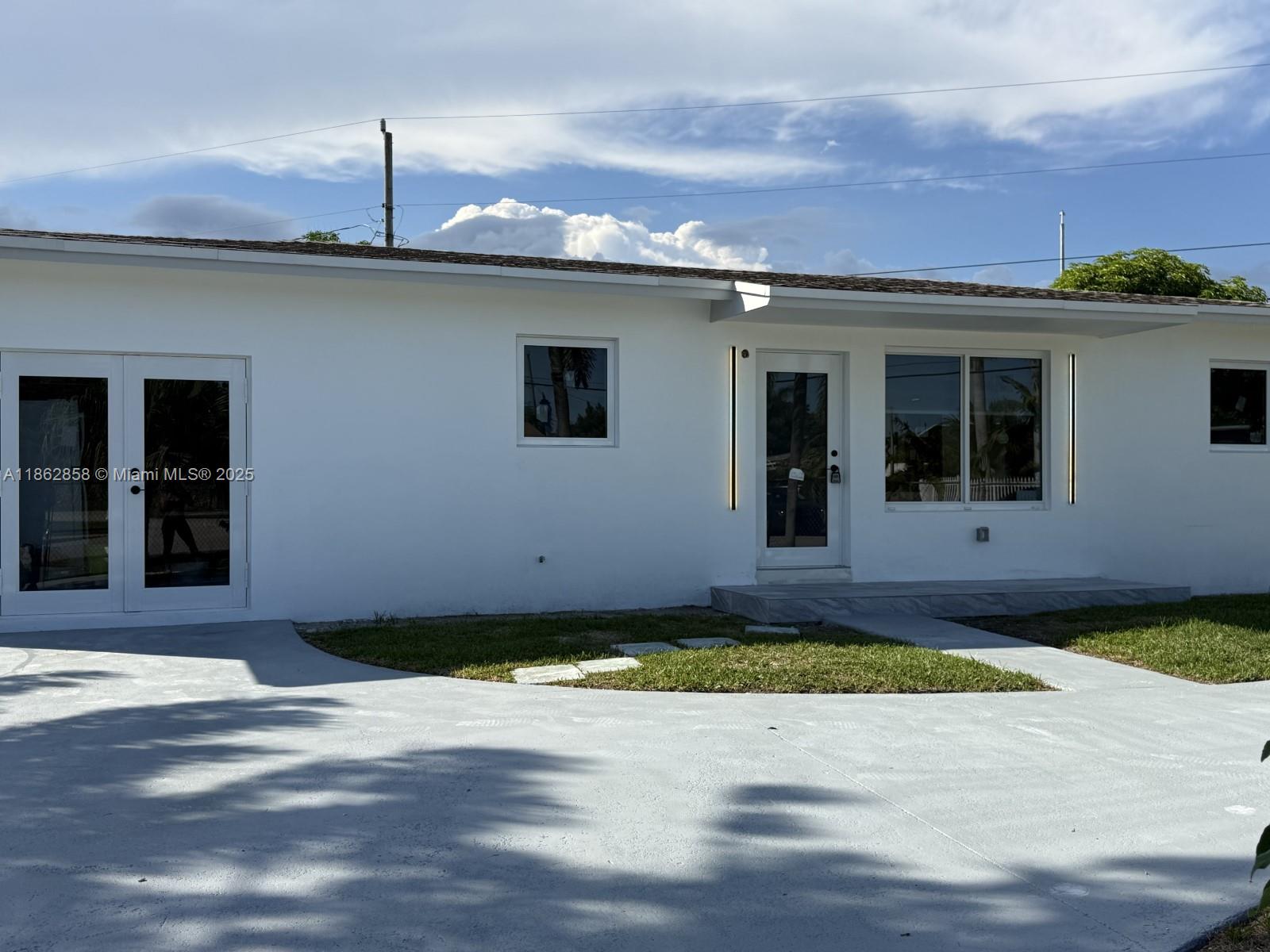 11805 Southwest 185th Street Miami, FL 33177 - Photo 6 of 28 a view of a house with a yard