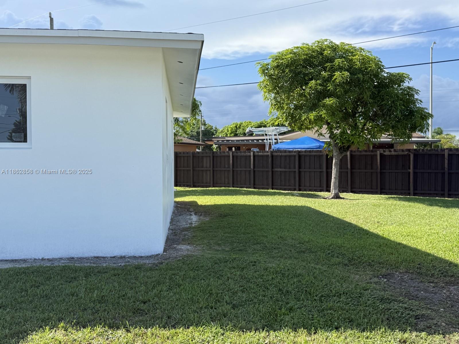 11805 Southwest 185th Street Miami, FL 33177 - Photo 7 of 28 a view of a backyard with a small cabin