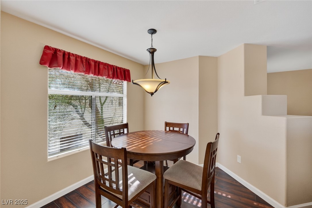 698 South Racetrack Road, Unit 1222 Henderson, NV 89015 - Photo 14 of 31 Dining space featuring dark wood-style floors and baseboards