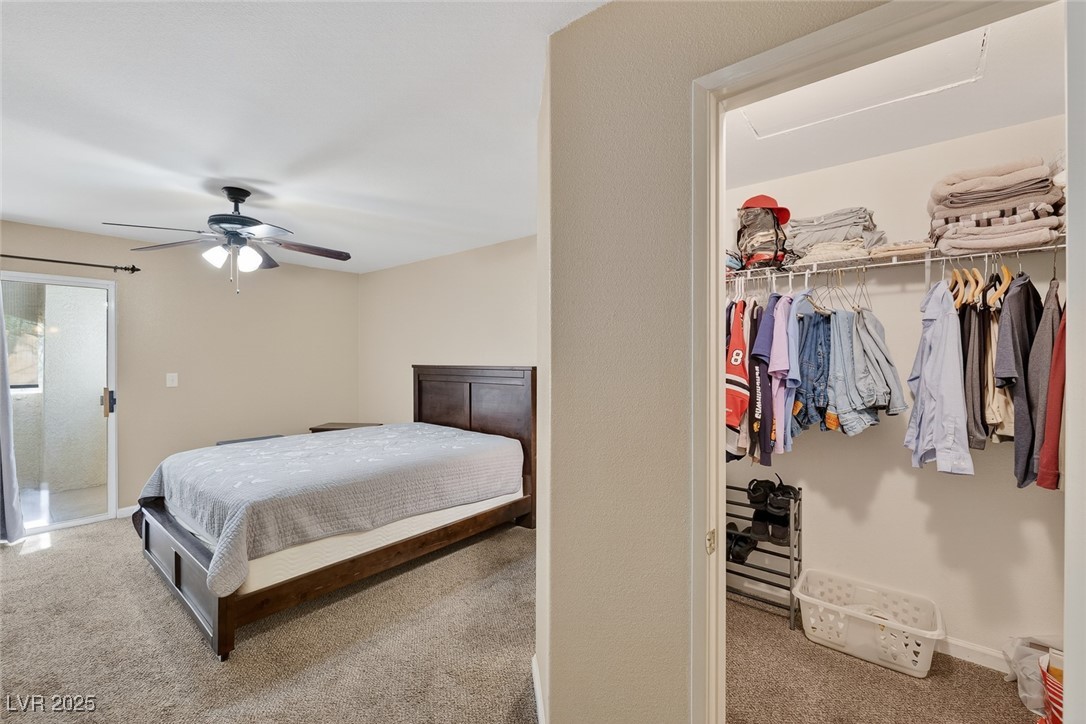 698 South Racetrack Road, Unit 1222 Henderson, NV 89015 - Photo 18 of 31 Bedroom featuring light colored carpet, a closet, and a ceiling fan