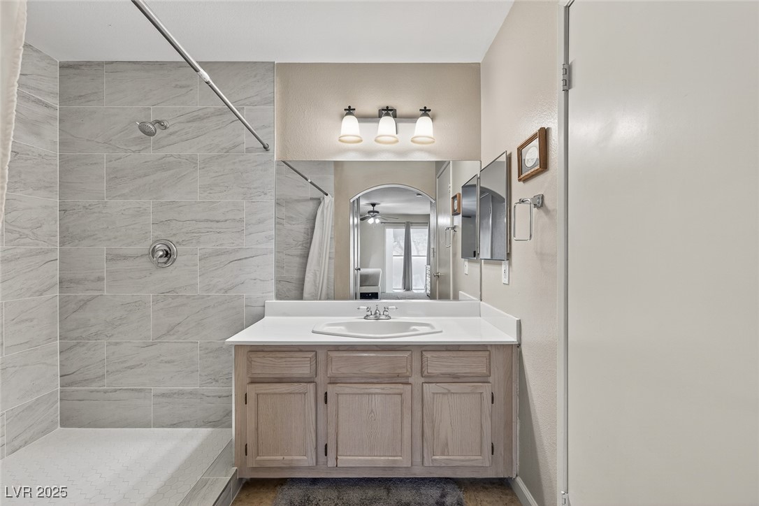 698 South Racetrack Road, Unit 1222 Henderson, NV 89015 - Photo 19 of 31 Bathroom with vanity and tiled shower