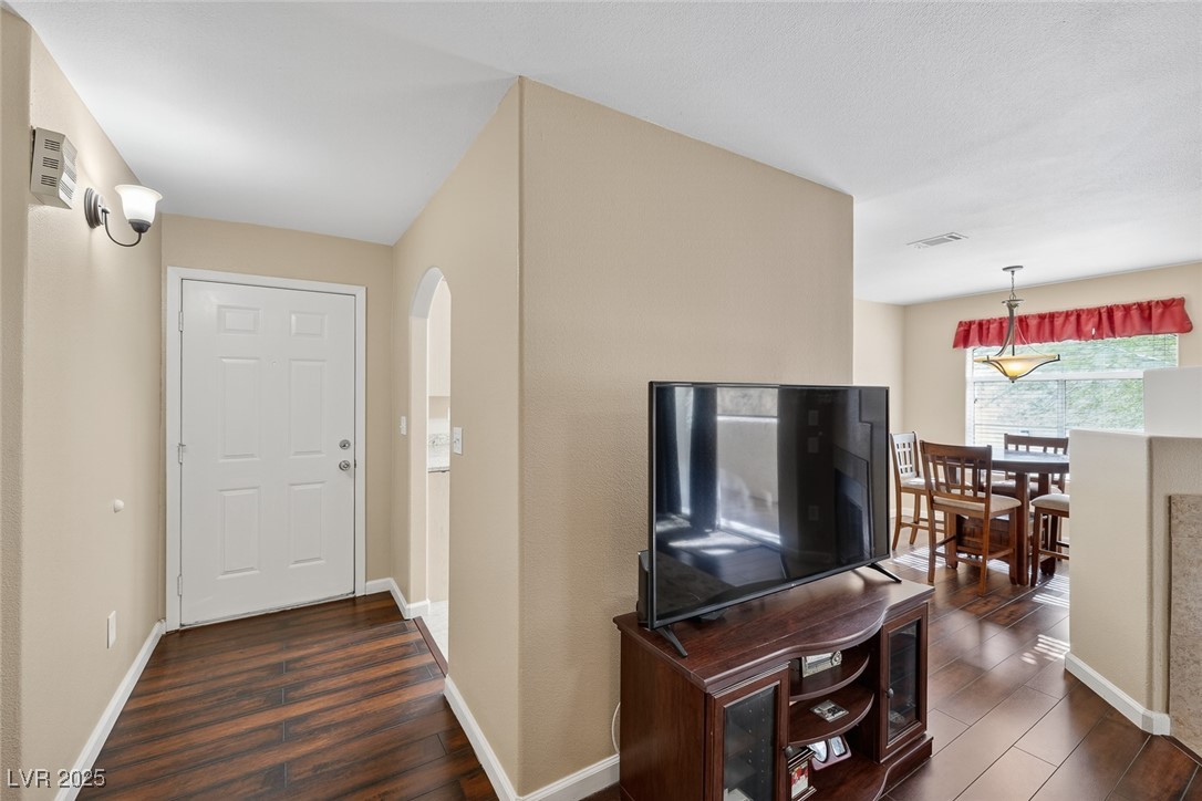 698 South Racetrack Road, Unit 1222 Henderson, NV 89015 - Photo 2 of 31 Foyer entrance with baseboards and dark wood-style floors