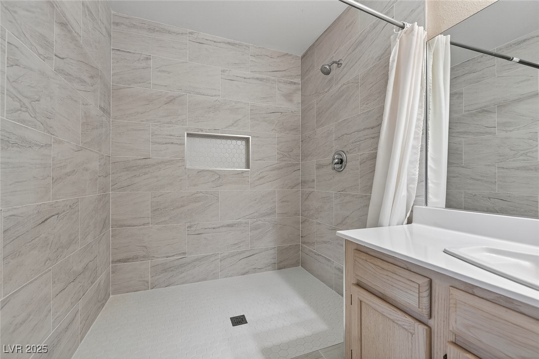 698 South Racetrack Road, Unit 1222 Henderson, NV 89015 - Photo 20 of 31 Bathroom featuring a stall shower and vanity